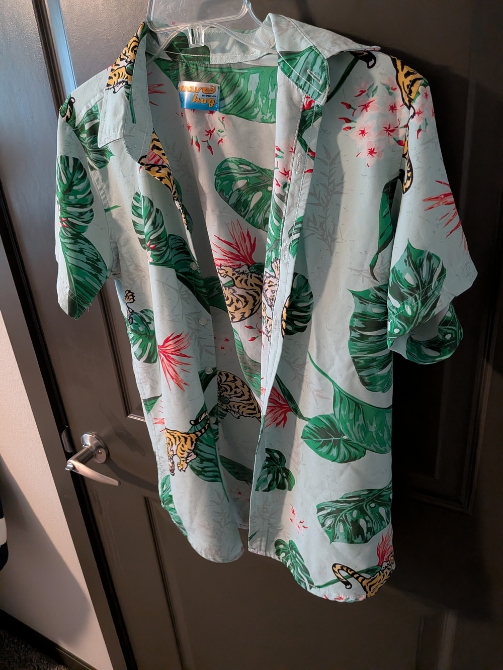 light blue Wave Hog button-up shirt featuring a tropical print of tigers and mon